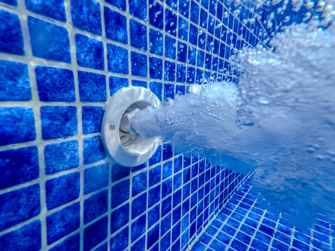 Underwater view of the pool mosaic tile and water jets