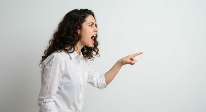 Furious young woman in shirt yelling and emphatically pointing towards the left - Powered by Adobe