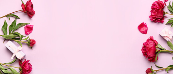 Beautiful peony flowers and gift boxes on lilac background