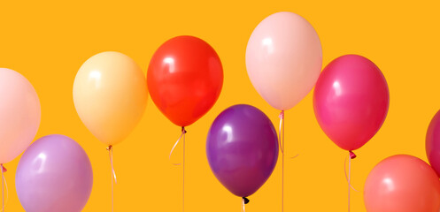 Many colorful balloons on orange background