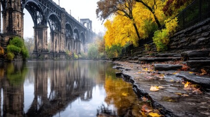 Autumnal bridge reflected in still water