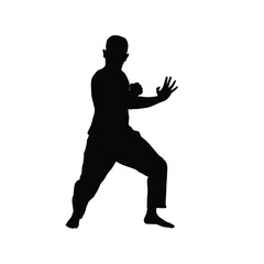 Silhouette of a man demonstrating martial arts or silat movements
