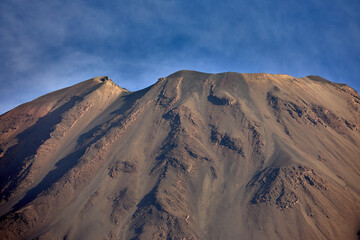 Naklejka premium Captured through a telephoto lens, Volcán Misti reveals its striking symmetry and quiet strength—majestic, timeless, and always watching over the White City.