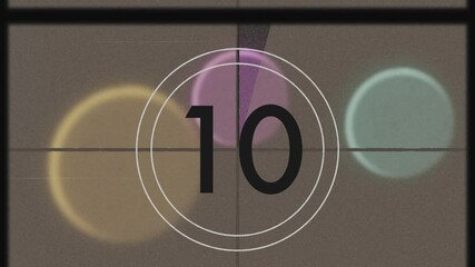 Drifting circles on abstract stage, black text sliding and vintage countdown overlay omitting nine