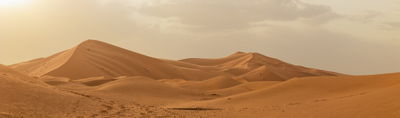 Sunset panoramic landscape views of Erg Chebbi sand dunes located in Morocco on the western edge of the Sahara Desert