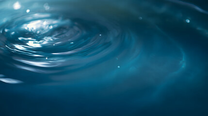 Deep blue swirling water patterns, an abstract dance of light and motion, evoking serenity and fluidity.
