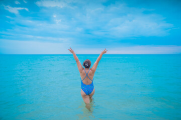 Portrait beautiful young asian chubby woman happy smile around sea ocean beach and blue sky for leisure travel vacation