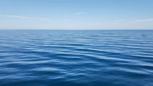 Calm Blue Ocean with Gentle Waves Under a Clear Sky Serene Seascape