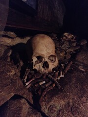 skulls inside the cave of toraja culture in Londa