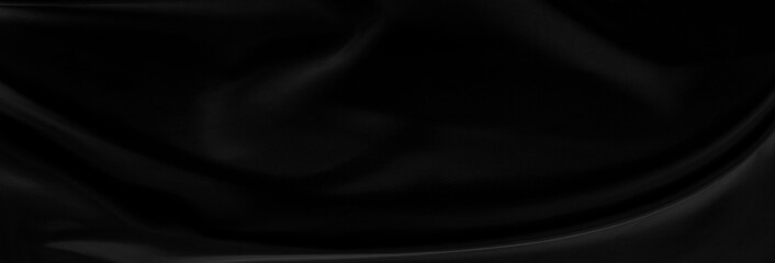 Black gray satin dark fabric texture luxurious shiny that is abstract silk cloth panorama background with patterns soft waves blur beautiful.