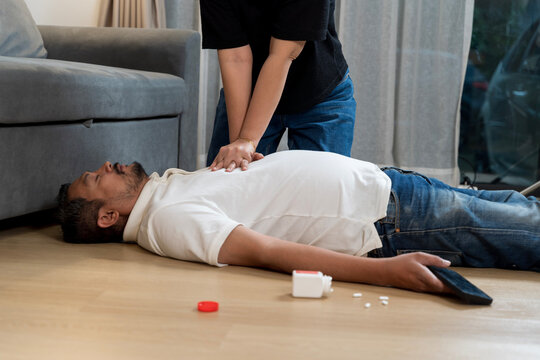 Emergency CPR performed on unconscious man after possible overdose or collapse at home in critical situation