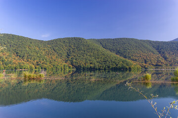 Mirror Lake Reflects Lush Green Hills in Azerbaijan