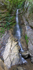 Tall Waterfall Cascades Down Rocky Cliff in Azerbaijan