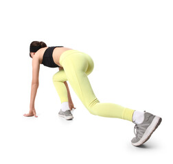 Beautiful young sporty woman getting ready to run on white background, back view