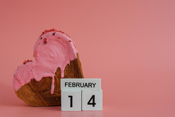 14 February calendar date Delicious fresh croissant topped with colorful flavor Ganache. Creation...
