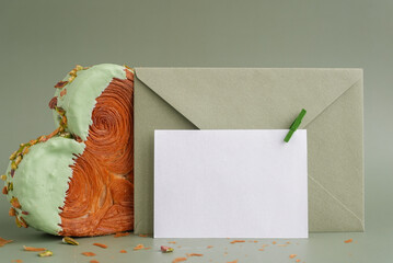 White empty mock up template paper note card Delicious fresh croissant topped with Matcha Green Tea...