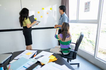 Young Business Professionals Collaborating on a Business Project in a Meeting Room.