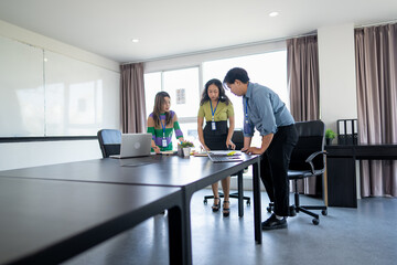 Young Business Professionals Collaborating on a Business Project in a Meeting Room.