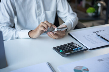 Fototapeta premium Successful Businessman Using Smartphone During Office Work