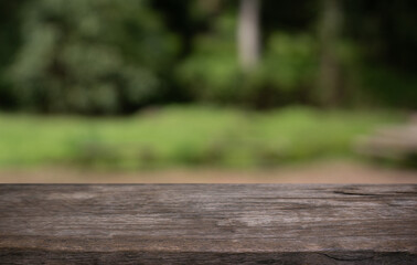 Empty wood table top and blur of restaurant background selective focus product display