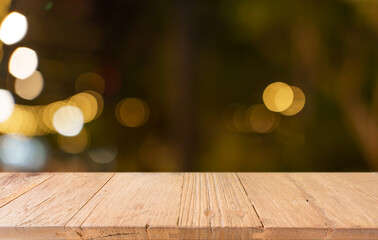 Empty wood table top and blur of restaurant background selective focus product display