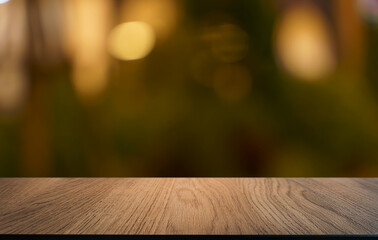 Empty wood table top and blur of restaurant background selective focus product display