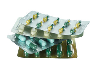 Bulk capsule pills blister packs isolated on white background.