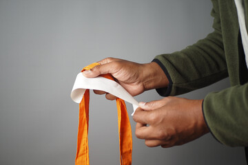 hand holding a receipt and shopping bag 