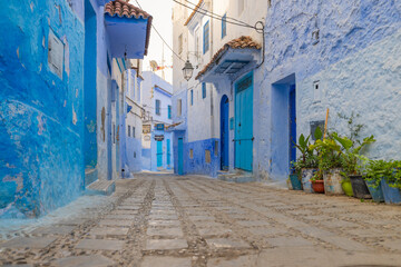 Scenic views of the blue washed walls and doorways in the old town Medina area of Chefchaouan located in the Rif Mountains of northwest Morocco