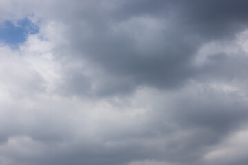 overcast sky filled with dark and light gray clouds, conveying a sense of moodiness