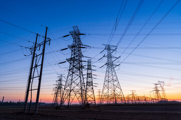 The pylons are in the evening, Substation in the evening, High voltage substation and beautiful sunset glow