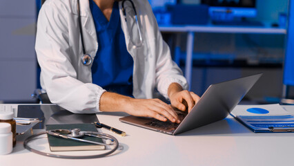 Caucasian male medical doctor provides expert online consultations using laptop, offering...