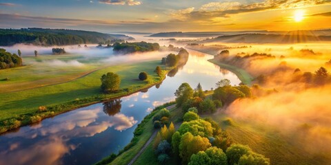 Fototapeta premium Aerial view of misty river valley surrounded by lush green fields and wildflowers