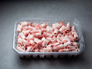 Frozen pork belly in a packaging container