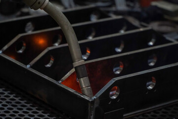 Industrial robots are welding,movement of robots welding automotive parts.