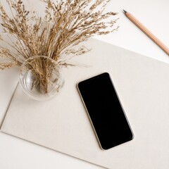 Dried grasses, phone, art supplies