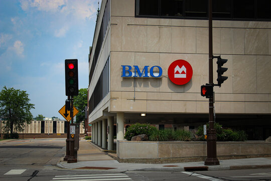 Wausau, Wisconsin - June 8, 2025: A BMO fascia sign and logo on a building with a crosswalk in the forefront. Editorial Use Only.