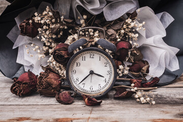 Fading of time or aging days concept. Bouquet of red roses gypsophila that has withered faded. old...