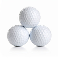 Three golf balls stacked in a pyramid shape against a clean, white backdrop