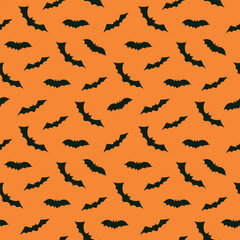 Seamless pattern with bats on orange background