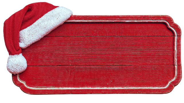Empty red wooden sign with Santa Claus hat in corner, perfect for holiday messages, Christmas announcements, or festive greeting displays