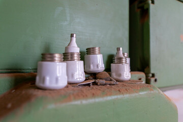 Abandoned industrial hall with old furniture, metal parts, and dusty workspaces. Atmospheric lost...