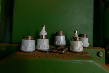 Abandoned industrial hall with old furniture, metal parts, and dusty workspaces. Atmospheric lost...
