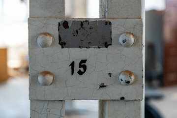 Abandoned industrial hall with old furniture, metal parts, and dusty workspaces. Atmospheric lost...