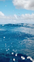 A vibrant, close-up view of ocean water, showcasing its deep blue hues and sparkling surface with subtle ripples