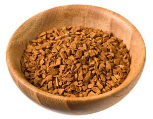 Freeze dried coffee powder in a wooden bowl, isolated on white background.