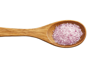 Pink spice granules in wooden spoon