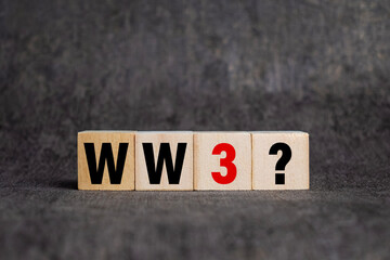 world war 3 with question mark on wooden blocks isolated on dark background