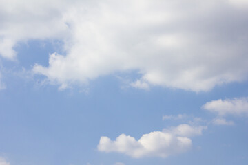 Blue sky with puffy clouds