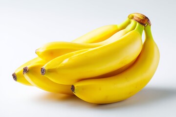 Fresh and Ripe Yellow Bananas Arranged on a White Background for Healthy Eating and Culinary Use in Various Dishes and Desserts